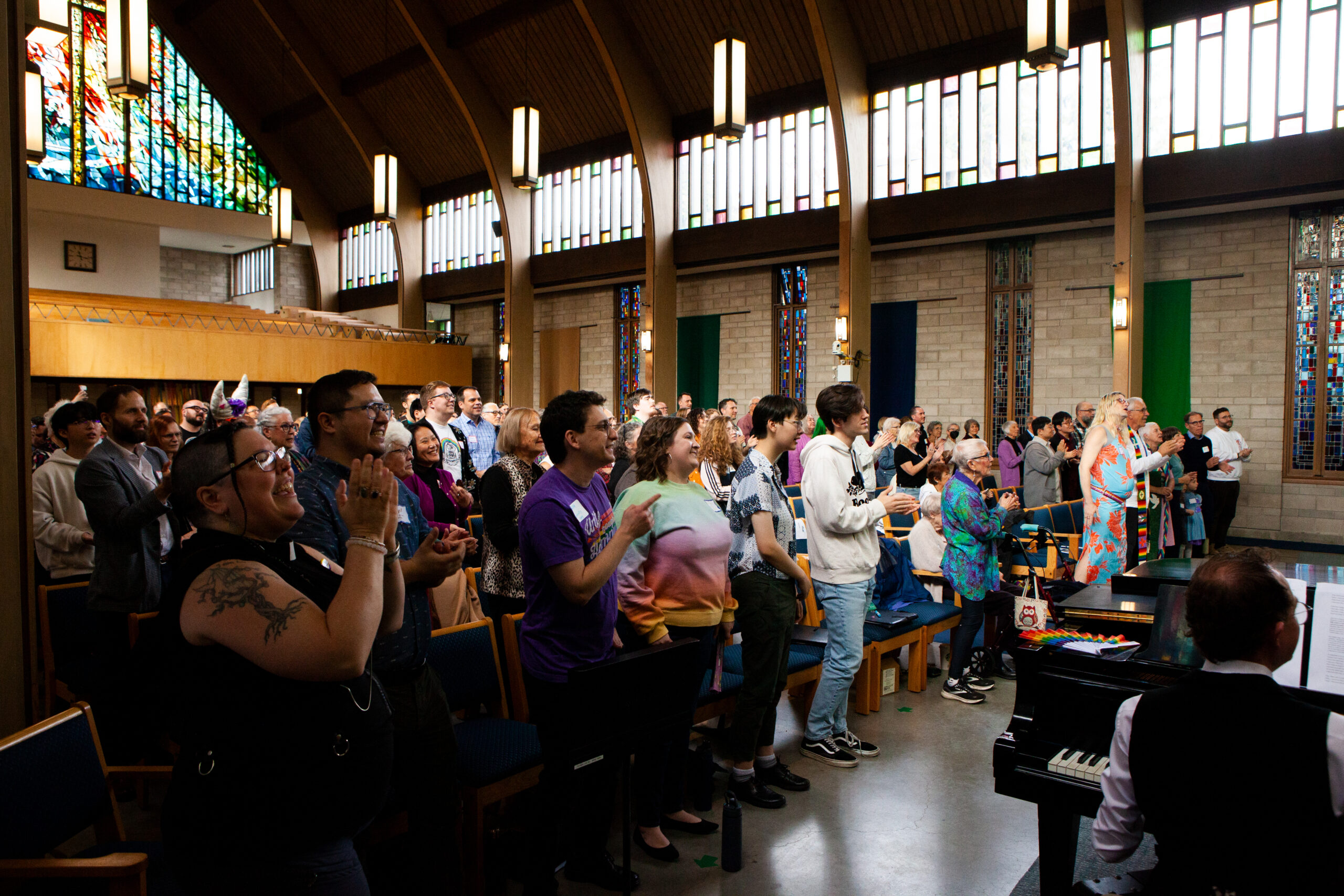 A diverse group of people gather in Shaughnessy Heights United Church for a drag communion service.