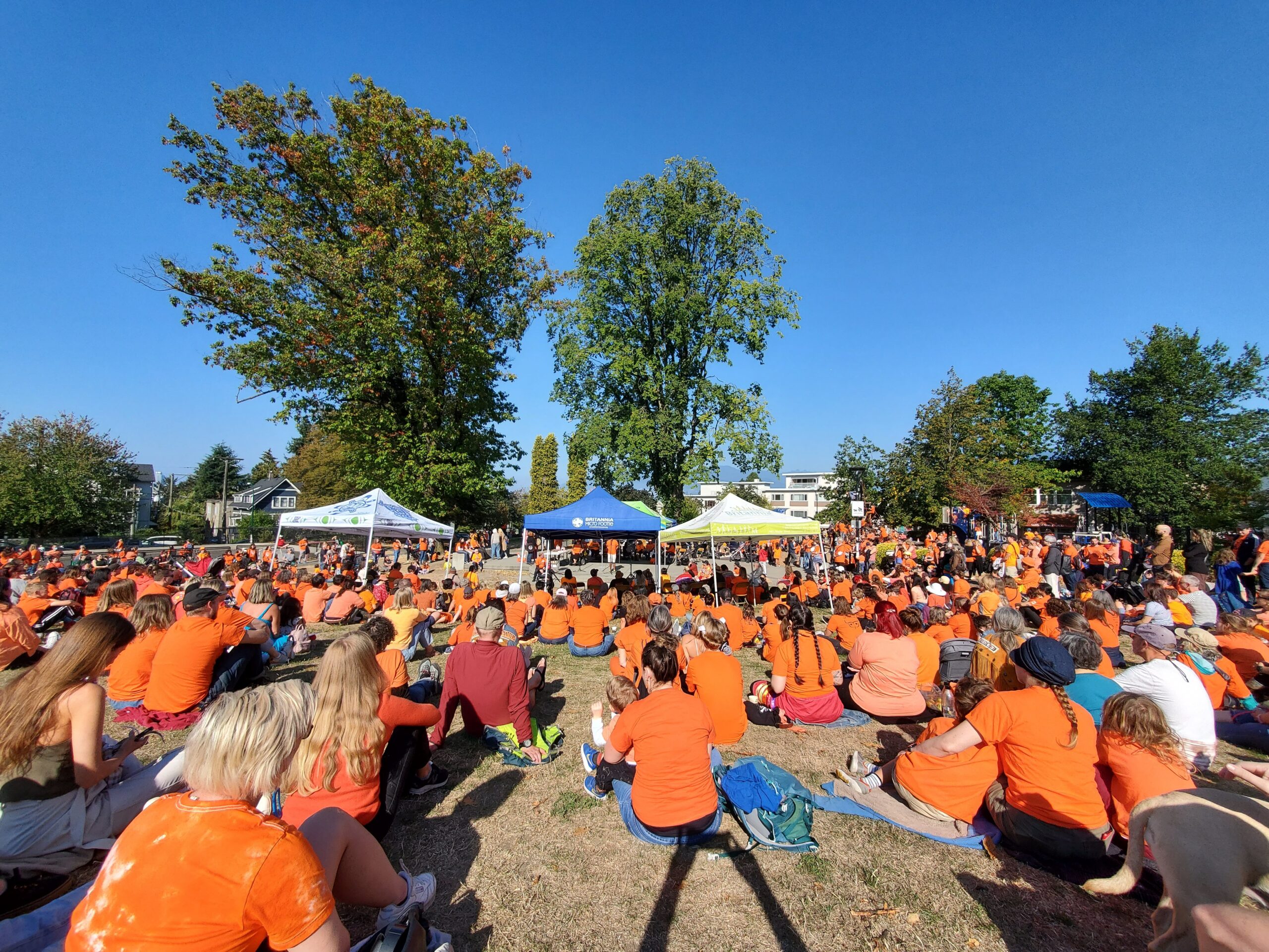 Many people gather in orange shirts to honour the National Day for Truth and Reconciliation.