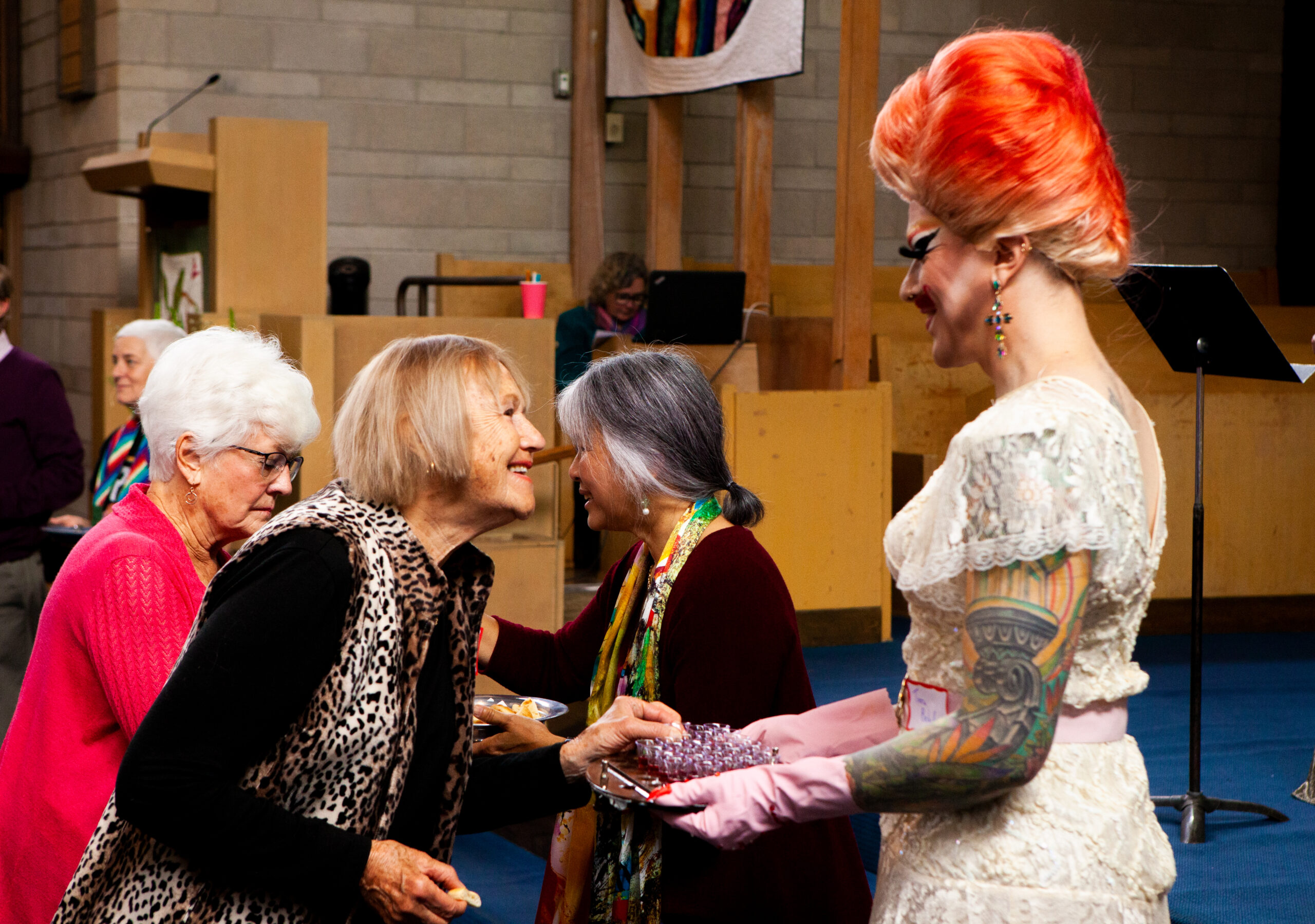 Drag queen liturgists offer the eucharist to members of the Shaughnessy Heights United Church congregation.